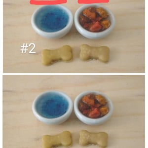 May include: Miniature pet food and water bowls with bone-shaped treats. The bowls are white with blue and brown contents. The treats are light brown. The image includes measurements of .75" and .5".
