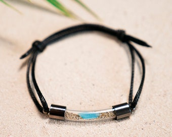 Black Laced Bracelet with Ocean Plastic Waste and Sand from Beaches Around the World in Curved Glass Vial