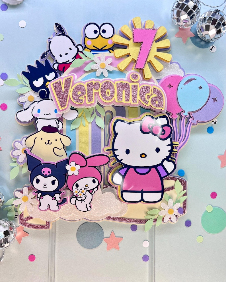 May include: A colorful cake topper featuring Hello Kitty, My Melody, and other popular cartoon characters. The topper includes a pink and yellow sun with the number 7, a pink and white cloud, and the name Veronica in pink glitter letters.