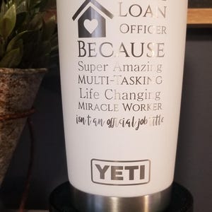 May include: White Yeti tumbler with silver accents, featuring text that reads "MORTGAGE LOAN OFFICER BECAUSE Super Amazing MULTI-TASKING Life Changing MIRACLE WORKER." The tumbler is on a black decorative stand.