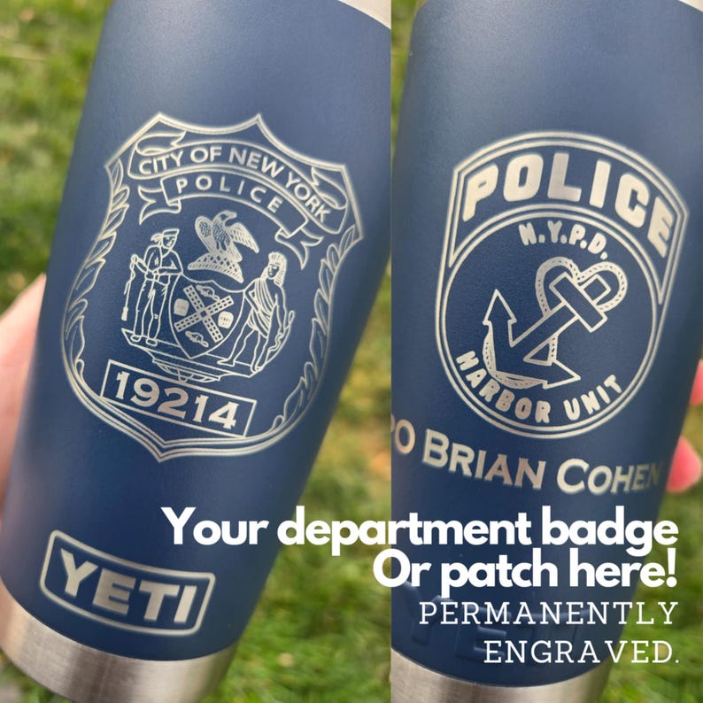 May include: A blue Yeti tumbler with a silver engraved design. The design features the City of New York Police Department logo and the text "19214". The tumbler also has the text "Your department badge or patch here! Permanently engraved."