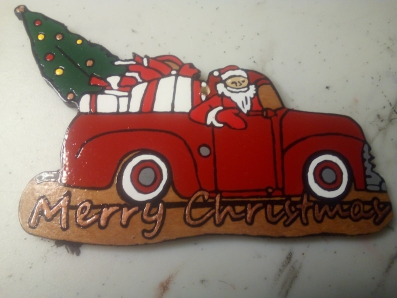 hand painted on 14 plywood with High Gloss Enamel paint. Santa in his Little Red Truck