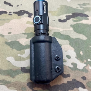 Kydex flashlight holder 1 inch tube.