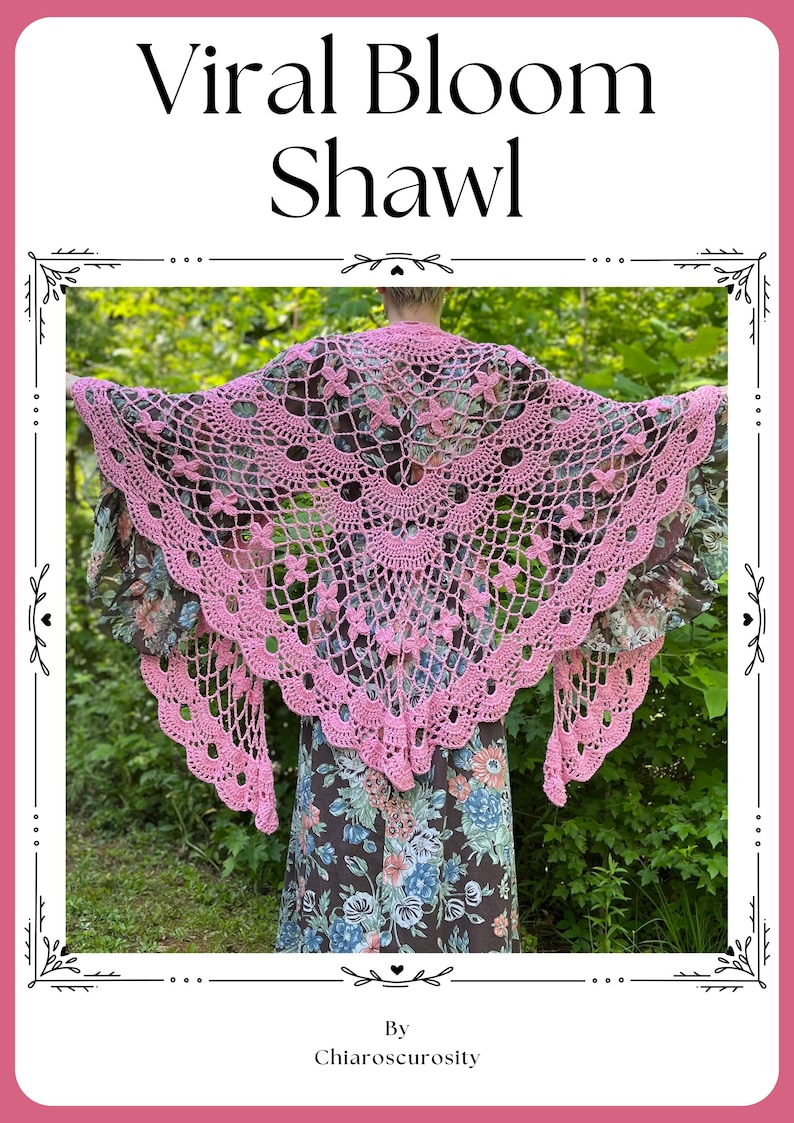 May include: A pink, hand-crocheted shawl with a floral pattern. The shawl is worn over a floral dress. The image features the text "Viral Bloom Shawl" at the top and "By Chiaroscuriosity" at the bottom, in a decorative frame.