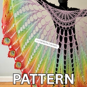 May include: A large, semi-circular crochet shawl featuring a vibrant rainbow gradient of red, orange, yellow, green, blue, and purple yarn. The design includes intricate openwork lace patterns and a scalloped edge. Text reads CHIAROSCUROSITY PATTERN.