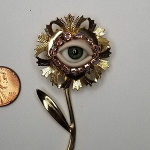 Fancy Flower Wink Gold toned vintage brooch glass doll eye. OOAK mixed media jewelry. Floral fantasy art. image 1