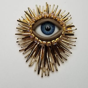 Sacred Wink - Vintage brooch. Striking mixed media art pin.  Spiky goldtone statement piece.  Evil eye protection. OOAK costume jewelry.