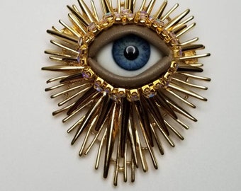 Sacred Wink - Vintage brooch. Striking mixed media art pin.  Spiky goldtone statement piece.  Evil eye protection. OOAK costume jewelry.