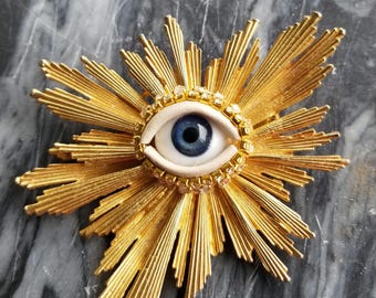 Let There Be Light Wink - Huge, spectacular, goldtone vintage brooch + glass doll eyes. Incredible mixed media jewelry.