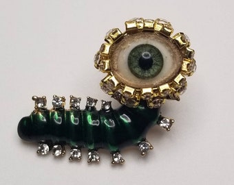 Caterpillar Wink -  Small surreal dream pin. Fun fantasy jewelry. Petite wearable avant guarde art.  Green doll eye. Insect bling