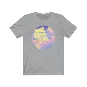 May include: A heather grey t-shirt with a pastel colored graphic of a sunset and crystals.