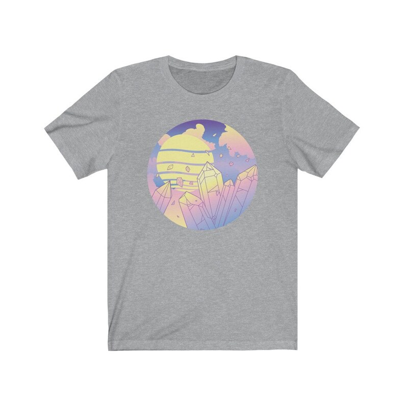 May include: A heather grey t-shirt with a pastel colored graphic of a sunset and crystals.