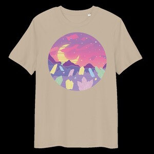 May include: A beige t-shirt featuring a graphic print of a crescent moon, a sunset, and crystals in a circle. The colours in the graphic are pink, purple, blue, yellow, and green.