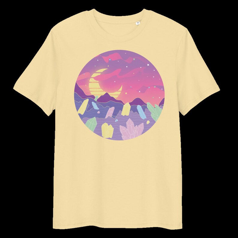 May include: A yellow t-shirt featuring a graphic of a crescent moon, a sunset, and crystals in a circle.