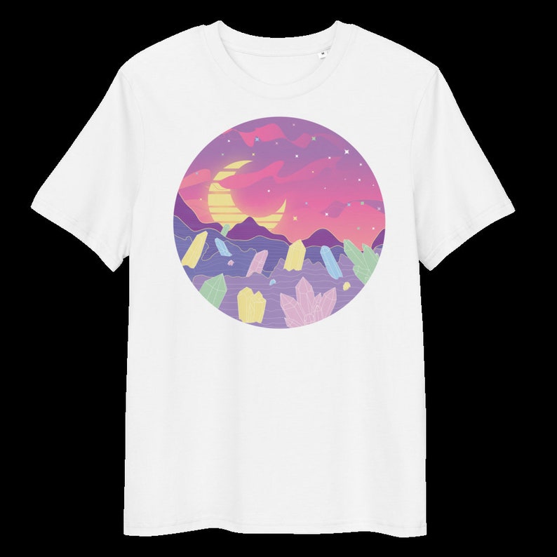 May include: White t-shirt featuring a graphic of a crescent moon, a sunset, and crystals in a circle.