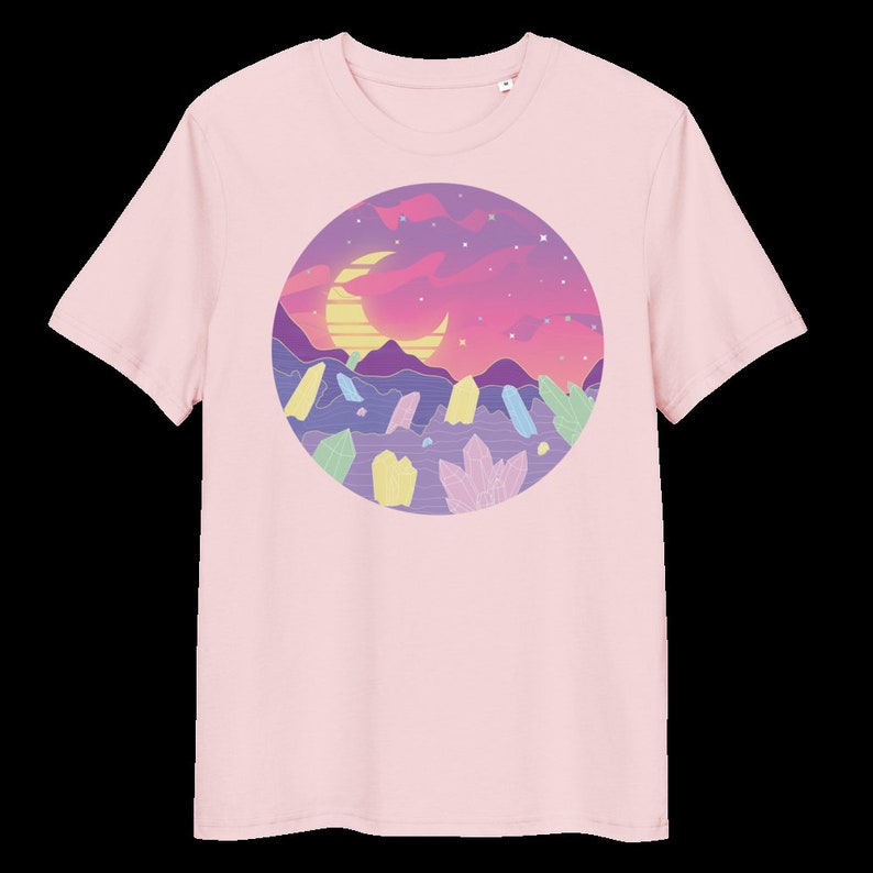 May include: Pink t-shirt featuring a graphic of a crescent moon, stars, and colourful crystals in a circle against a purple and pink sunset.