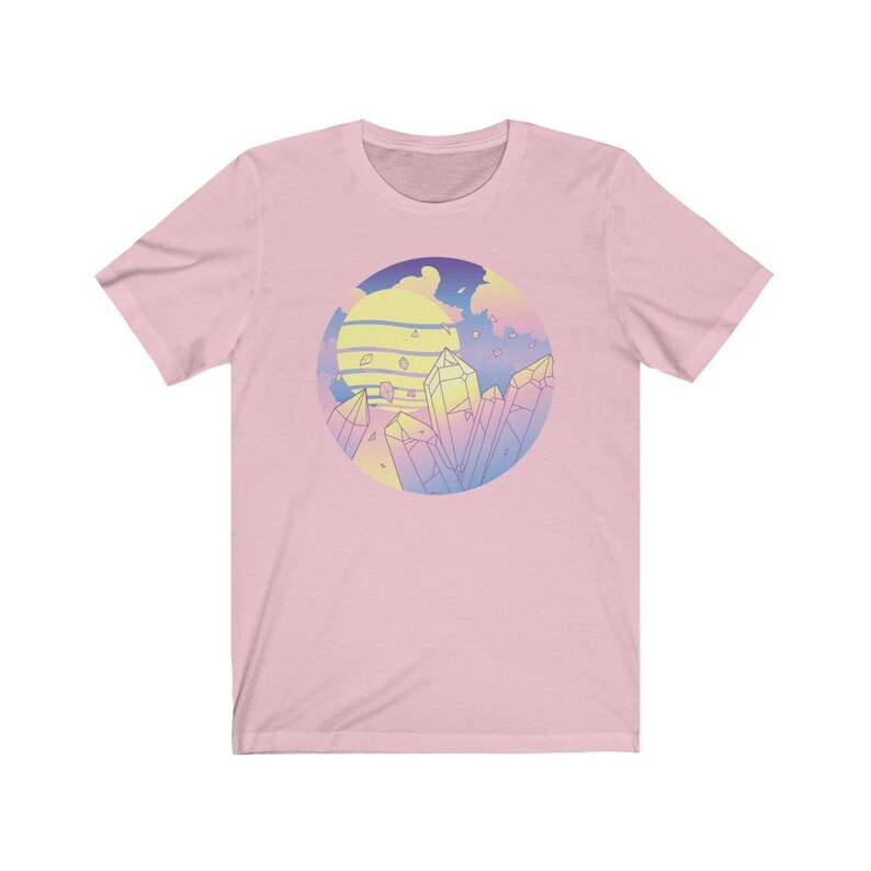 May include: Pink t-shirt with a graphic of a sunset and crystals in a circle. The crystals are in shades of pink, blue, and yellow.