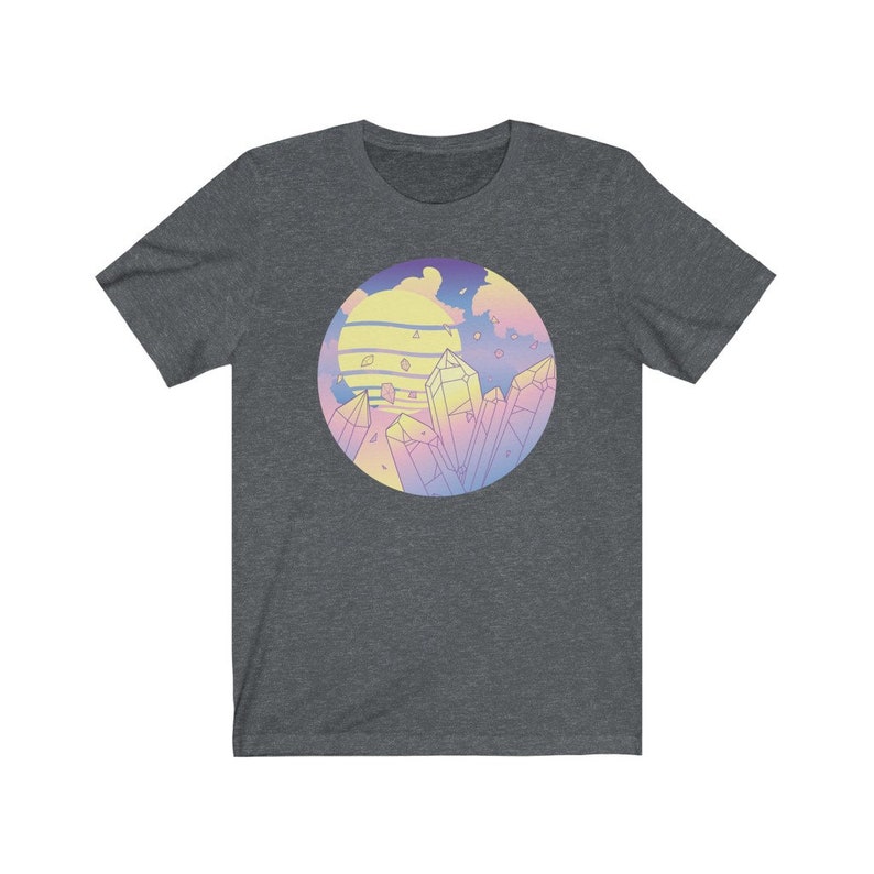 May include: A dark heather grey t-shirt with a pastel colored graphic of a sunset and crystals. The graphic is in a circle.