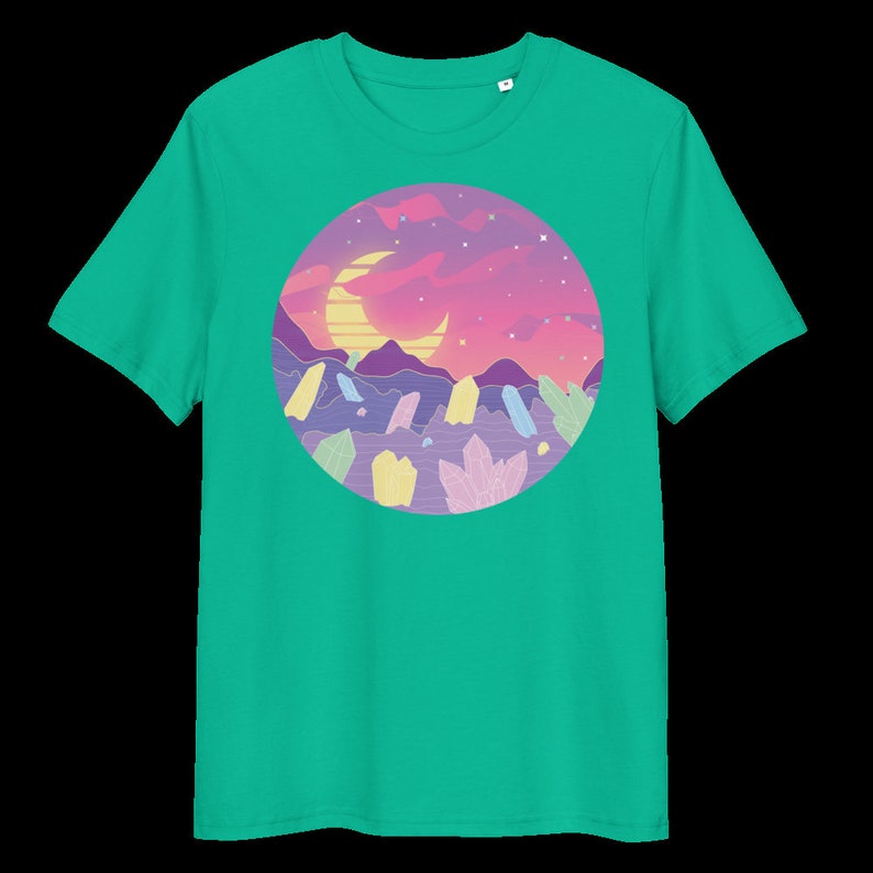 May include: A turquoise t-shirt featuring a circular graphic of a pink and purple sunset landscape with a crescent moon and yellow sun. The landscape is filled with colourful crystals.