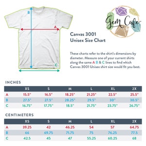 May include: A size chart for unisex t-shirts, showing measurements in inches and centimeters for sizes XS, S, M, L, XL, and 2X. The chart includes measurements for the width of the shirt (A), the length of the shirt (B), and the sleeve length (C).