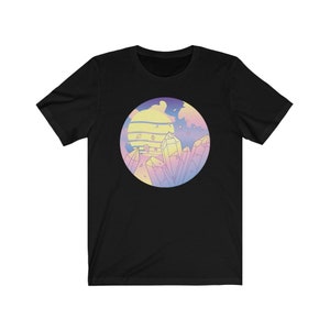 May include: Black t-shirt with a pastel colored graphic of a sunset and crystals in a circle.