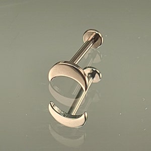 May include: A pair of rose gold crescent moon stud earrings. The earrings are made of surgical steel and are perfect for everyday wear.