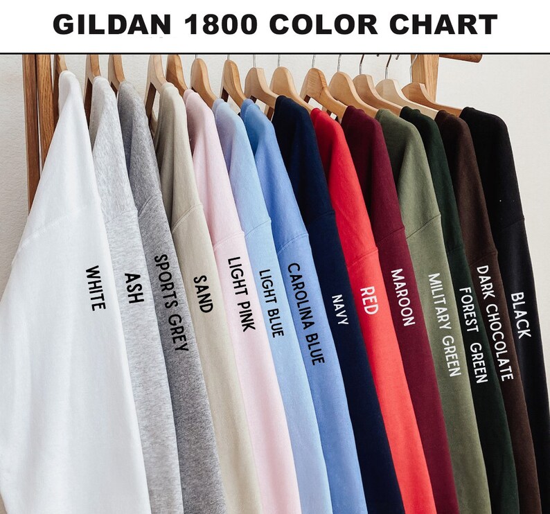 May include: A color chart of Gildan 1800 sweatshirts in various colors, including white, ash, sports grey, sand, light pink, light blue, Carolina blue, navy, red, maroon, military green, forest green, dark chocolate, and black. The text "GILDAN 1800 COLOR CHART" is at the top.