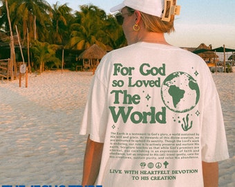 May include: White t-shirt with the text "For God so Loved The World" in green, along with a globe graphic. The shirt also features additional text about faith and devotion. The brand "THE JESUS TRIBE" is printed at the bottom.