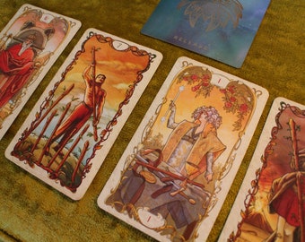 May include: Four tarot cards with colorful illustrations and ornate frames. The cards are from the "Release" deck and feature the numbers 1, 5, 7, and 11.