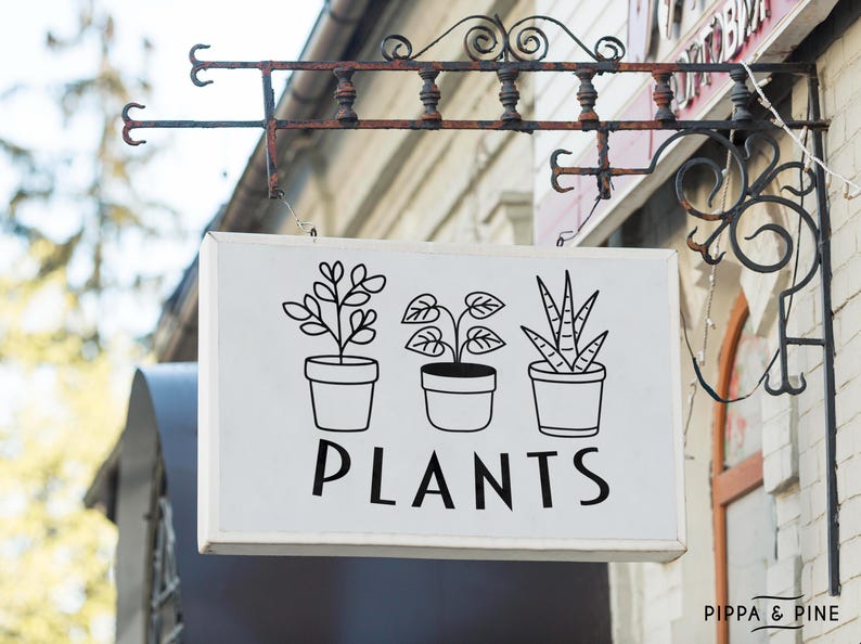 May include: A white sign with black line drawings of three potted plants and the word "PLANTS" in black lettering. The sign is hanging from a rusty metal bracket.