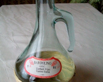 Wine jug, wine bottle with braid