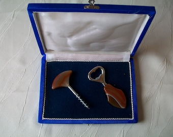 Gift set bottle opener and corkscrew in a velvet box