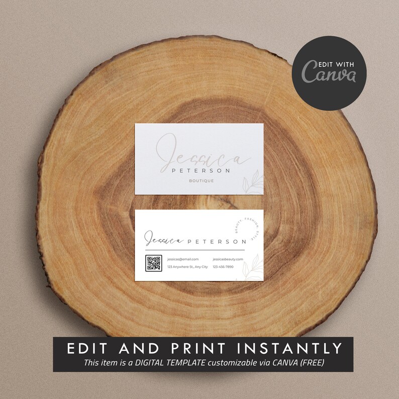 May include: A white business card with a minimalist design featuring the text "Jessica Peterson Boutique" in a handwritten font. The card also includes a QR code, contact information, and a small floral illustration.