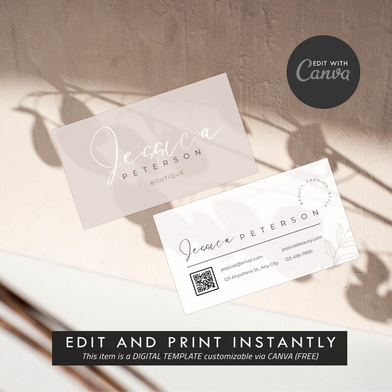 May include: A white business card with a minimalist design featuring the name "Jessica Peterson Boutique" in a handwritten font. The card also includes a QR code, contact information, and a small floral design.