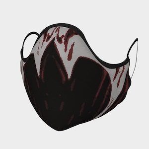 May include: A black face mask with a red and white pixelated design. The design features a dark, abstract shape with red accents.