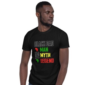 May include: Black t-shirt with the text "Black Dad The Man The Myth The Legend" in white with a red, green, and yellow graphic of the continent of Africa.