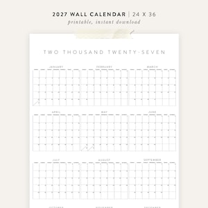 May include: A minimalist 2027 wall calendar, 24 x 36 inches, with a clean, grid-based layout. The calendar features the months January through September, with each month's days arranged in a weekly format. The text "TWO THOUSAND TWENTY-SEVEN" is at the top.