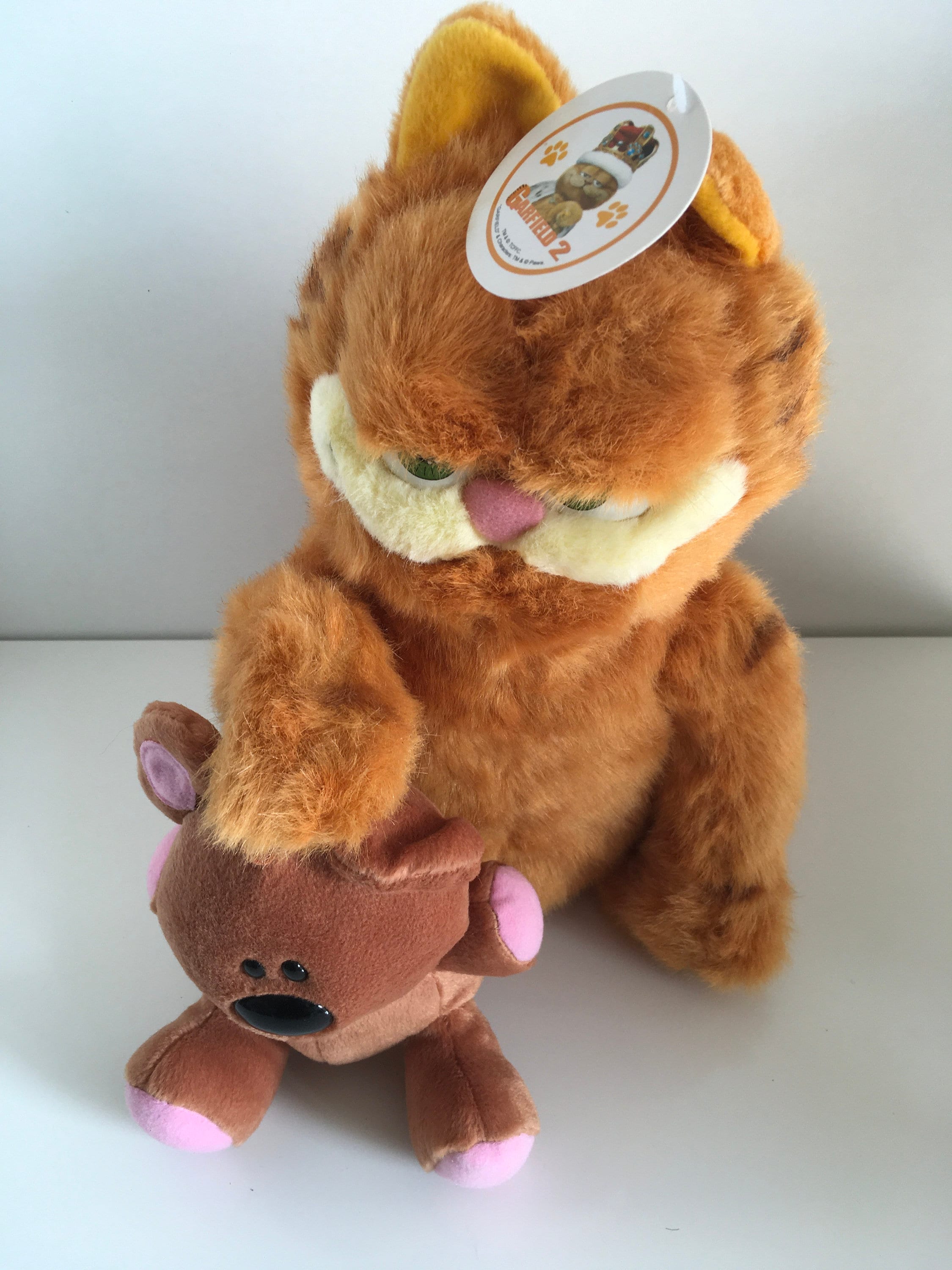 Film en peluche garfield 2 avec peluche en peluche caca neuve avec