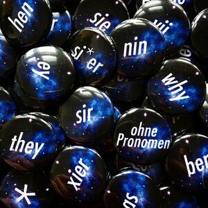 100 pronoun buttons of your choice.