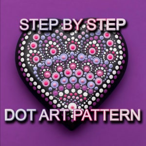 May include: A black heart-shaped rock painted with a dot art pattern. The pattern features white, pink, purple, and light blue dots of varying sizes.