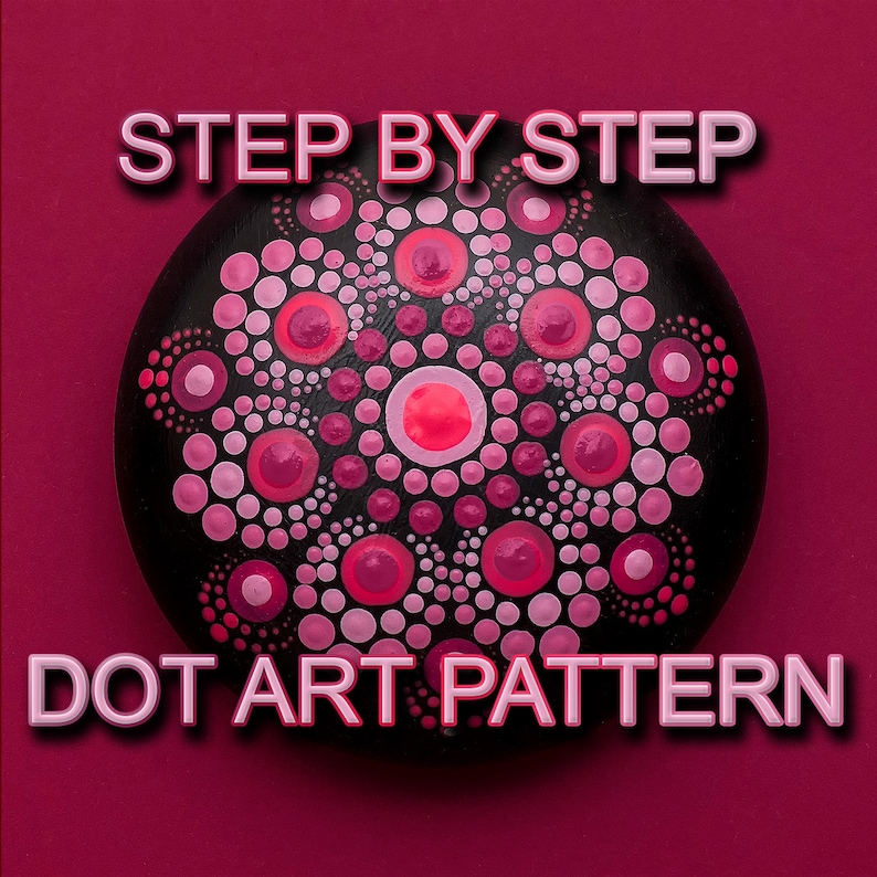May include: Step-by-step dot art pattern on a black rock. The pattern features pink and red dots arranged in a mandala design.