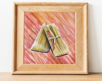 May include: A framed painting of two tamales with a red chili pepper on top, set against a pink and orange background.