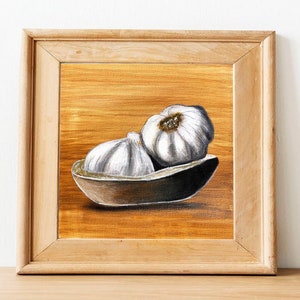 May include: A painting of two white garlic bulbs in a brown ceramic bowl on a golden background.