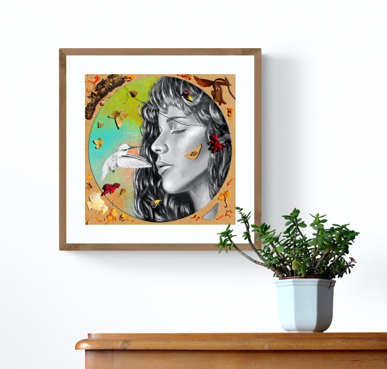 May include: A black and white drawing of a woman's face with her eyes closed. The woman's face is surrounded by a circle of colourful leaves and butterflies. The woman's face is surrounded by a circle of colourful leaves and butterflies.