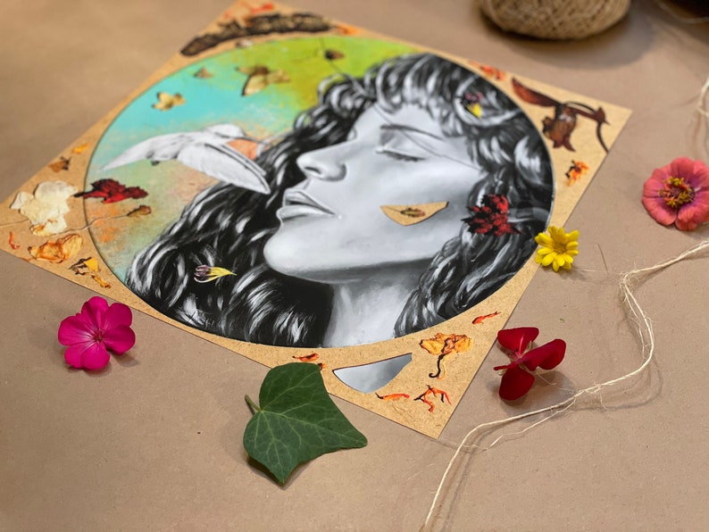 May include: A circular illustration on a brown background featuring a woman's face in the centre. The woman has long dark hair and closed eyes. The background is a collage of leaves, flowers, and other natural elements.