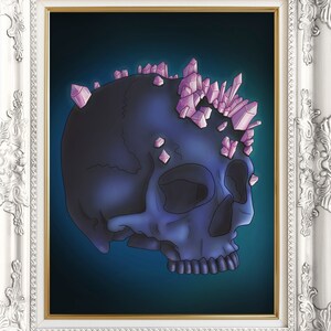 May include: A dark blue skull with pink crystal accents on top, set against a dark blue background. The skull is in a white ornate frame.
