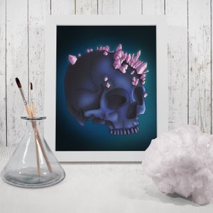 May include: A dark blue skull with pink crystal accents on top. The skull is set against a dark blue background.