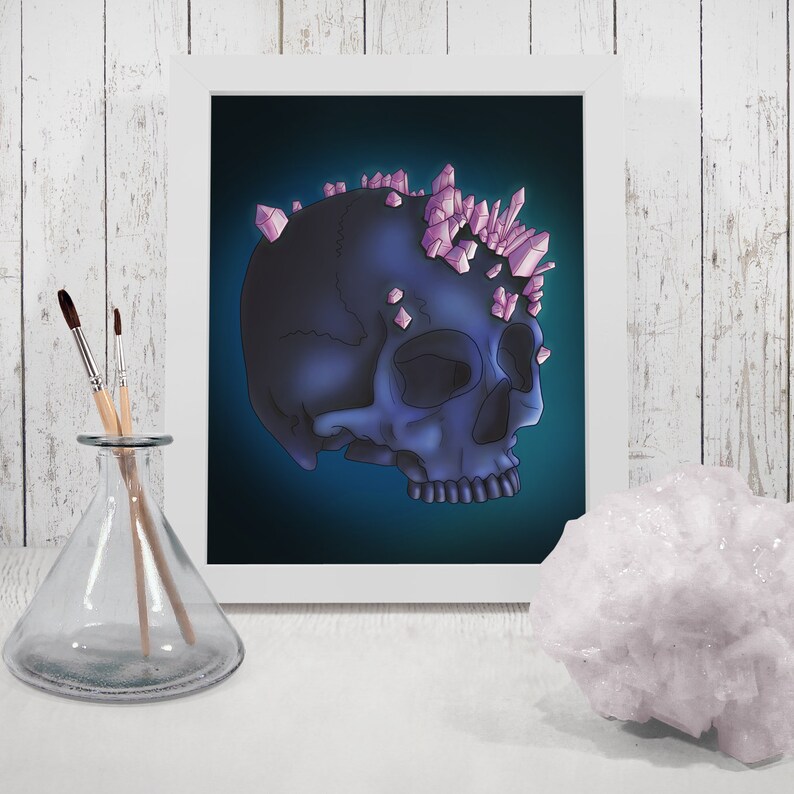 May include: A dark blue skull with pink crystal accents on top. The skull is set against a dark blue background.