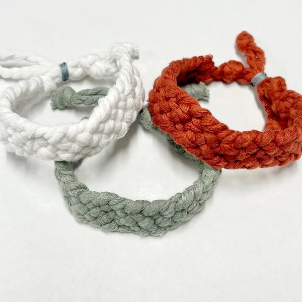 Gender Neutral Woven String into a Sailor Knot and is also adjustable