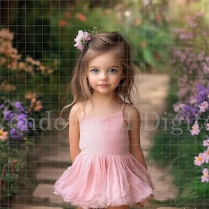 May include: A young girl with long blonde hair wears a pink dress and a flower crown. She is standing in a garden with purple flowers.